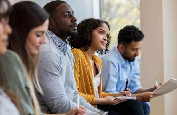 Learners watch a presentation, take notes