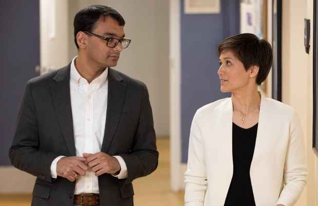 Two people walking and talking