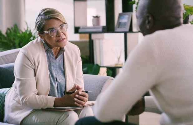 Female therapist speaking with a patient