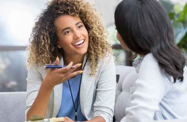 Therapist talks with young woman