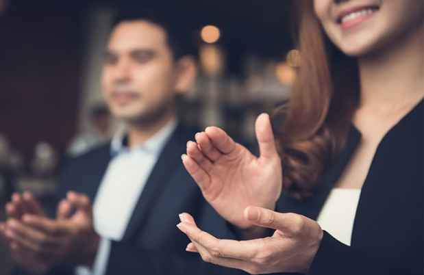 Man and woman clapping