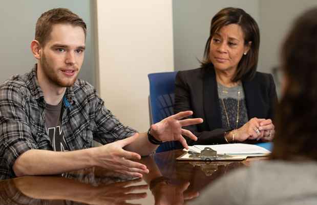College student talks during group therapy