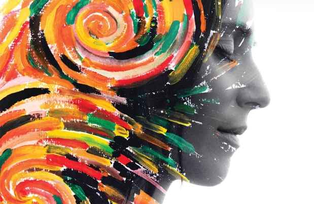 Stock image of woman in grayscale with colorful swirls in her head