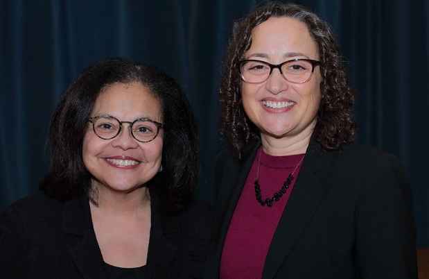 2 women posing for camera