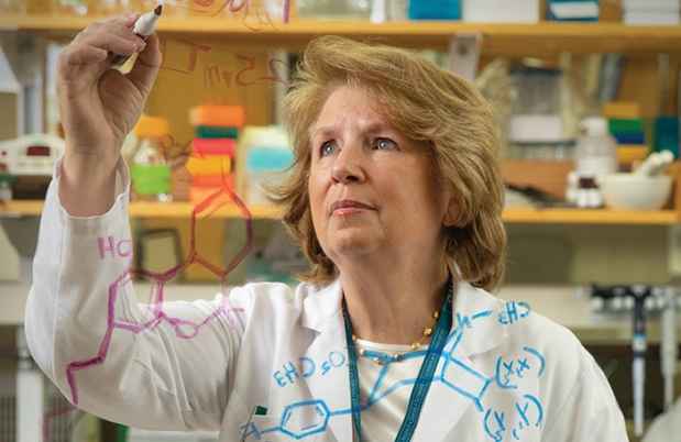 Dr. Bertha Madras working in a lab
