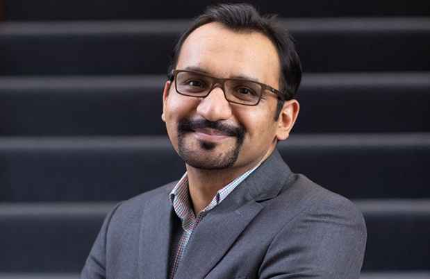 Dr. Alaptagin Khan with stairs in background