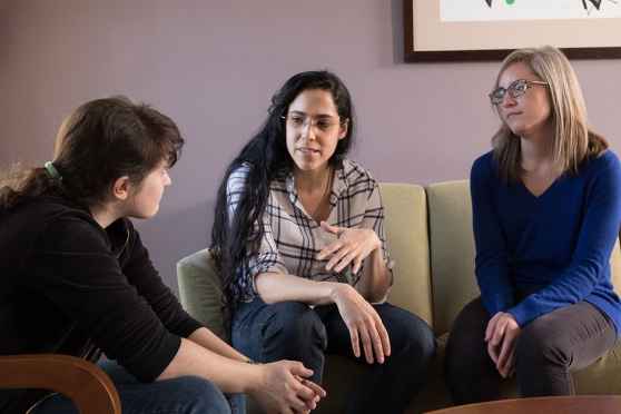 Young women talk in therapy at 3East DBT program for teens and young adults