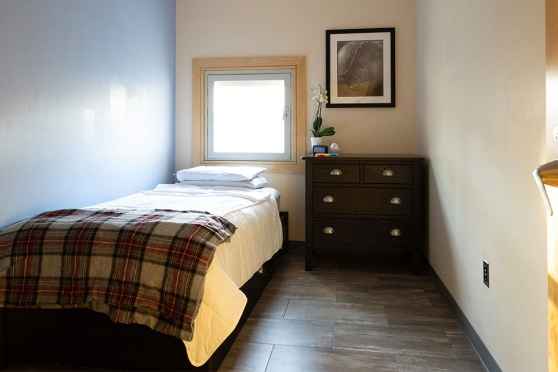 Bedroom - bed and dresser - accommodations at 3East DBT residential program for teens and young adults