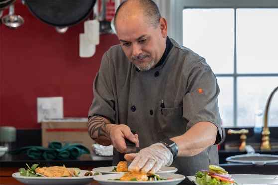 Chef prepares meals in well-appointed kitchen at the fernside addiction recovery program