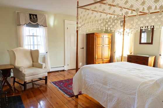 Well appointed bedroom bed and breakfast style - image of a bedroom suite at the fernside addiction treatment center in massachusetts
