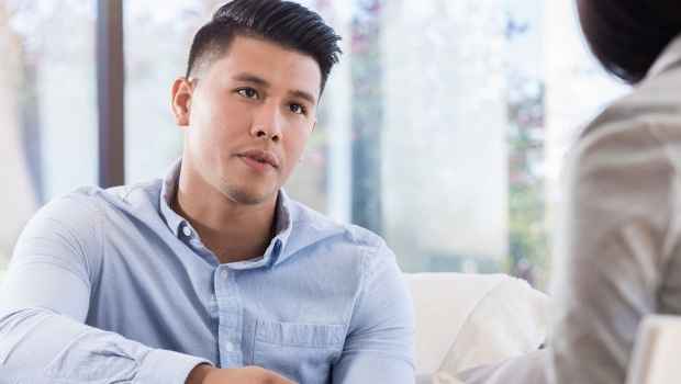 Man talks to clinician