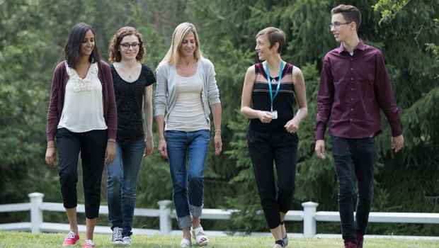 Young adult patients walk and talk outside
