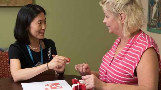 Provider works with patient on a neuropsychological puzzle test