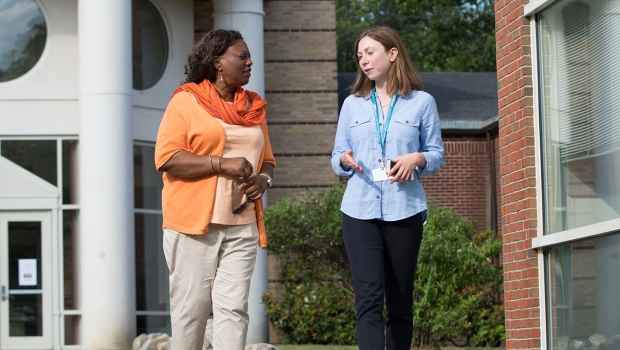 Patient and clinician talk outside