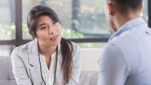 Clinician talks with patient
