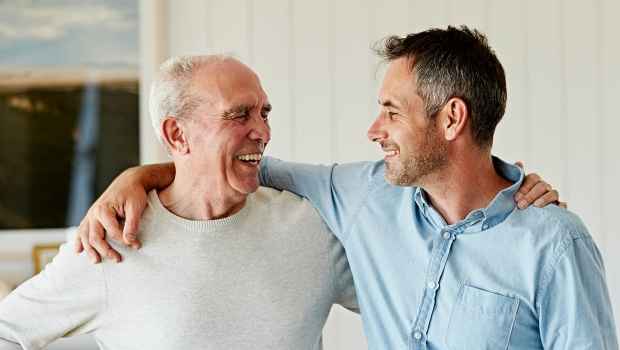 father and son with arm around each other