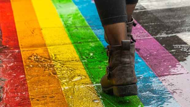 Walking on rainbow crosswalk