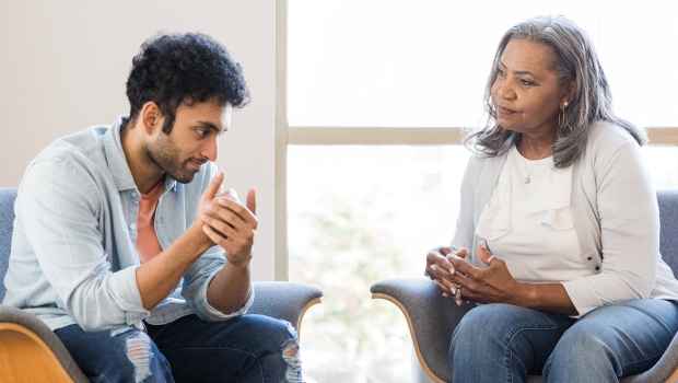 Man sits in therapy session